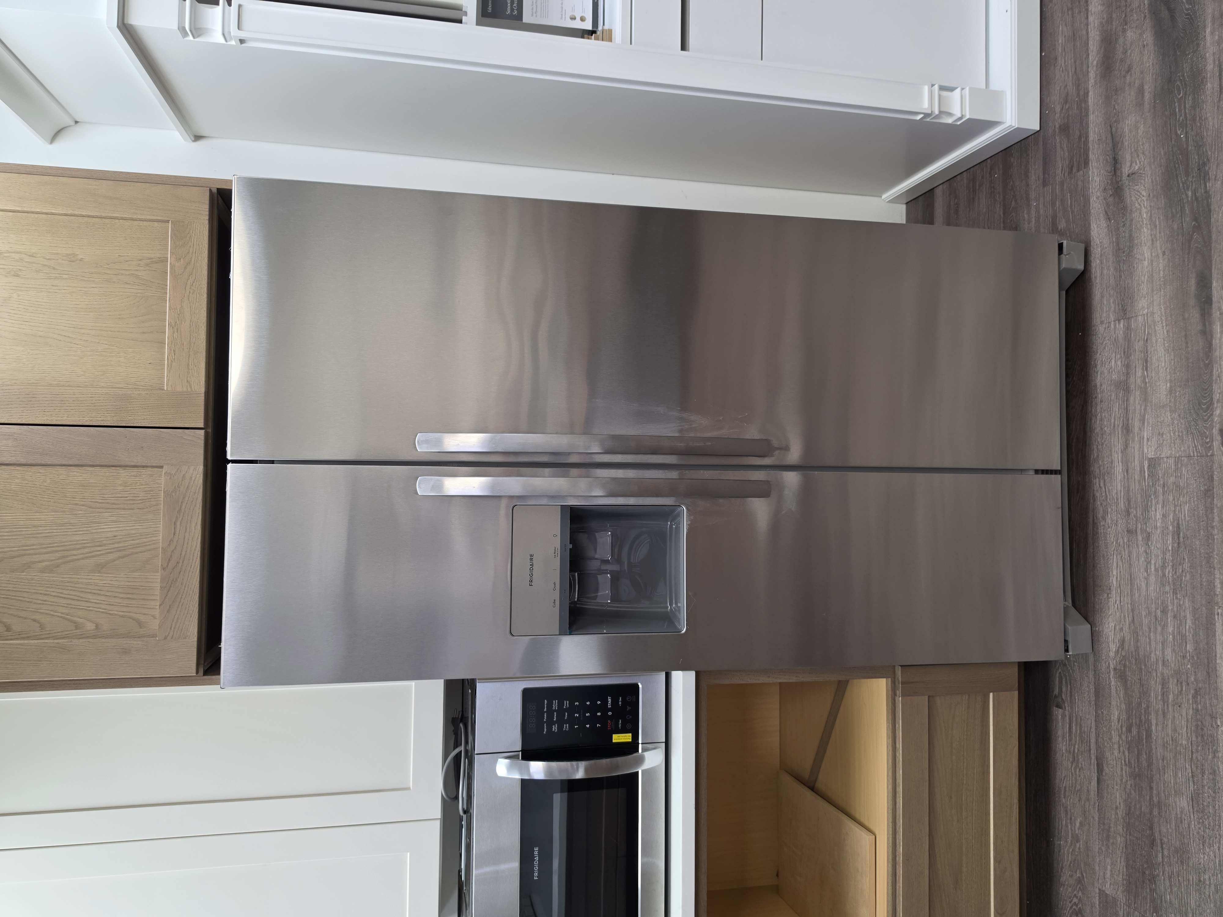 Stainless side-by-side refrigerator with water and ice dispenser