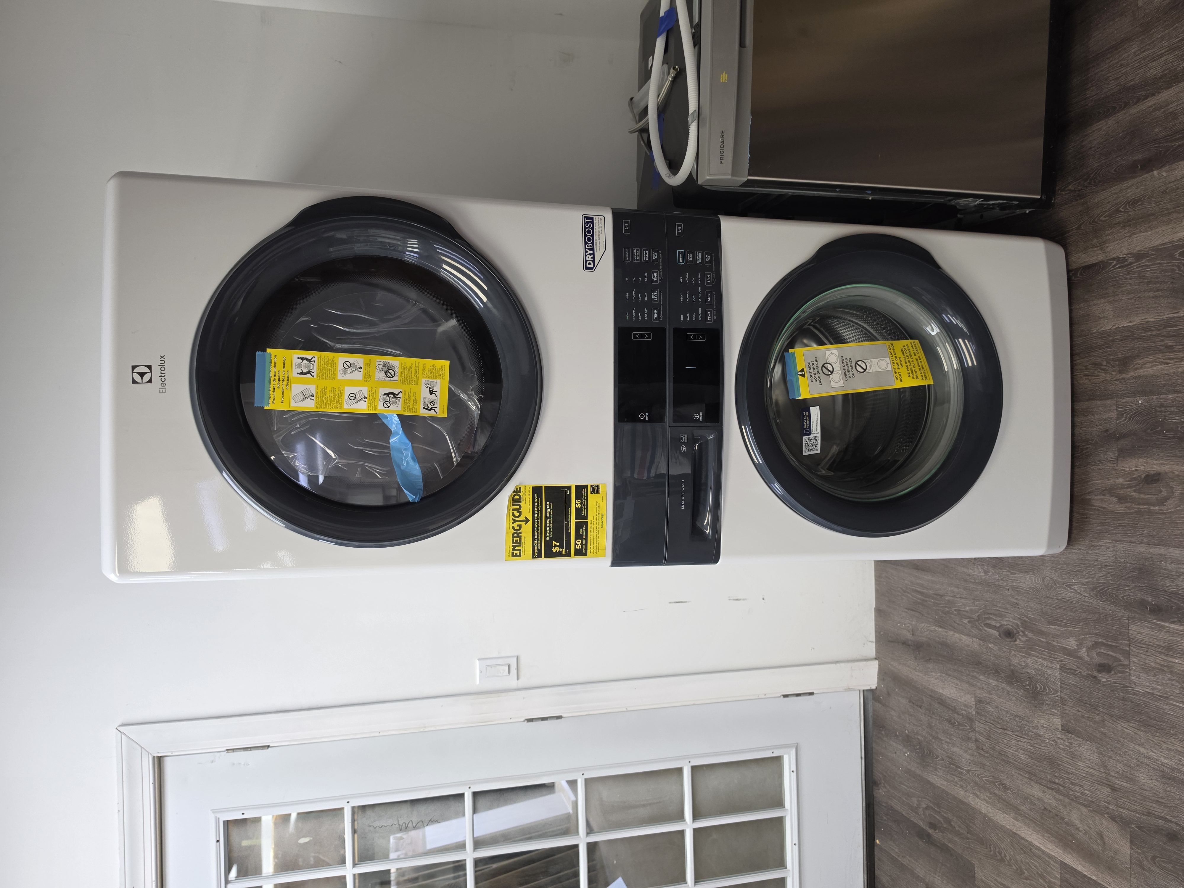 Stacked front-load washer and dryer laundry tower