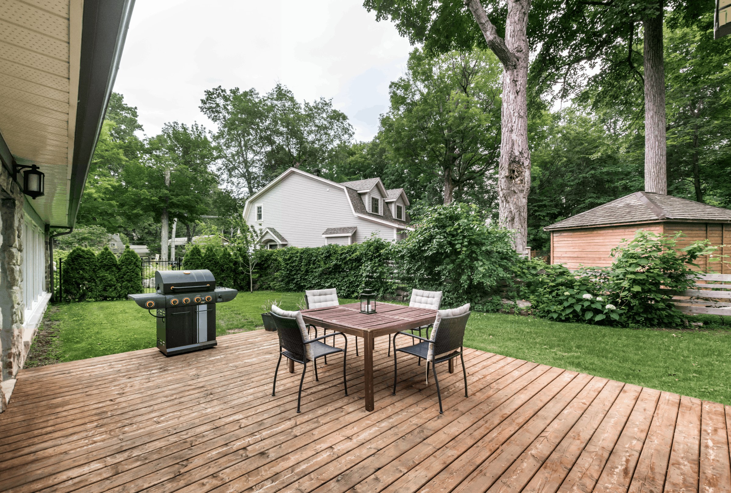 Backyard deck with outdoor dining furniture